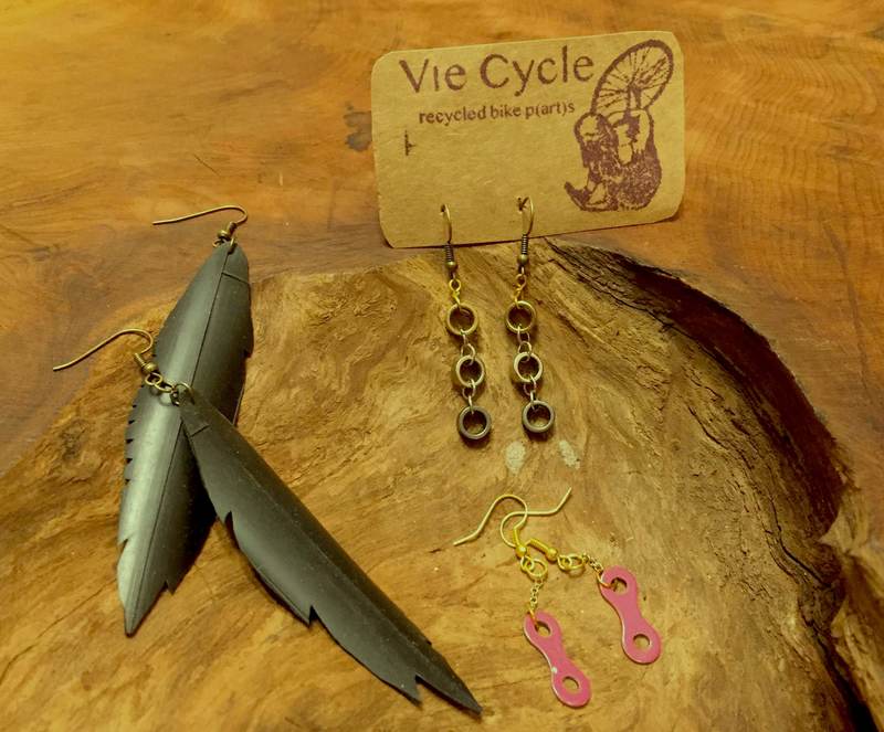 Assorted earrings made from recycled bike parts